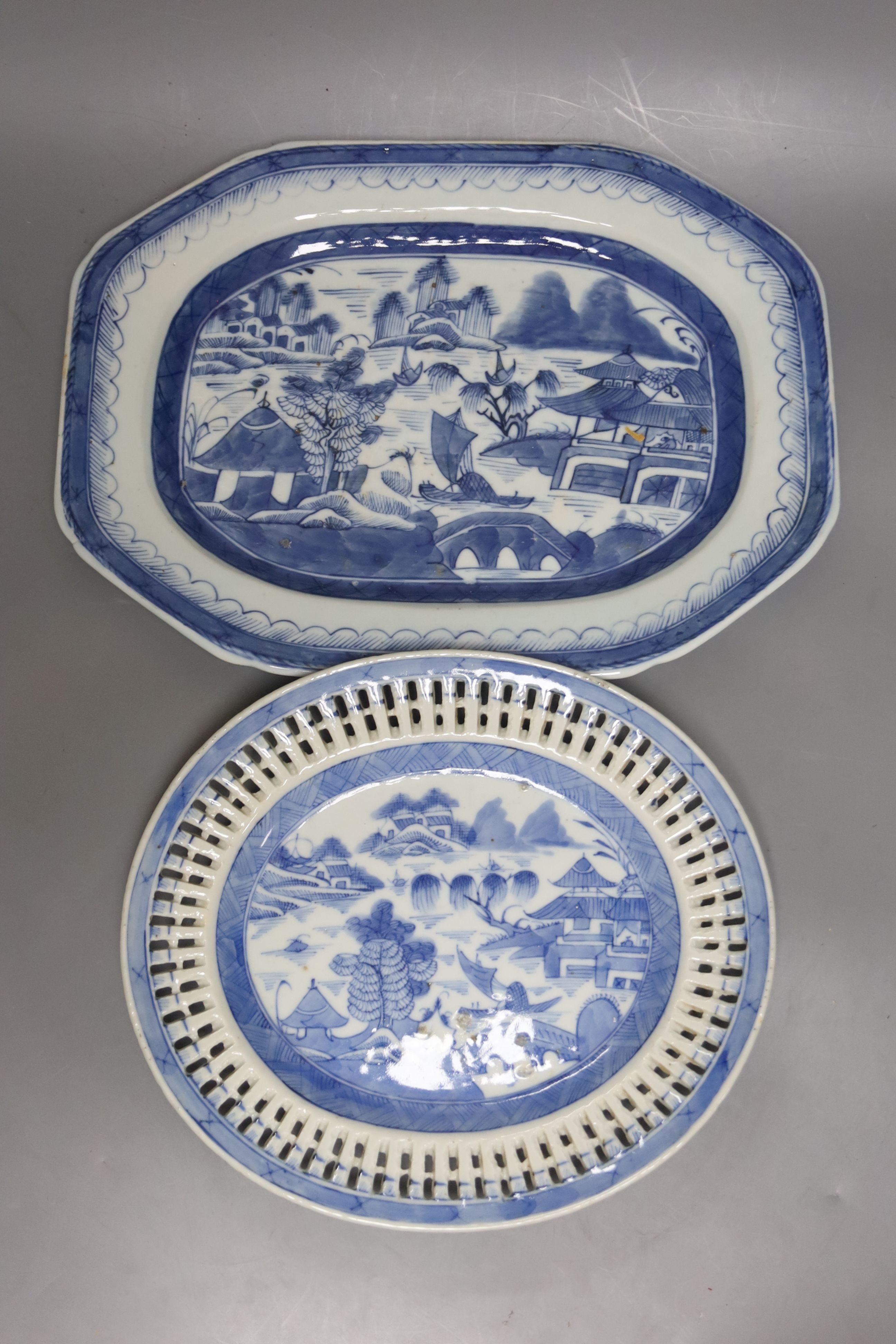 Two 19th century Chinese blue and white dishes and various jars and brush pots, largest item meat platter 33cms wide.